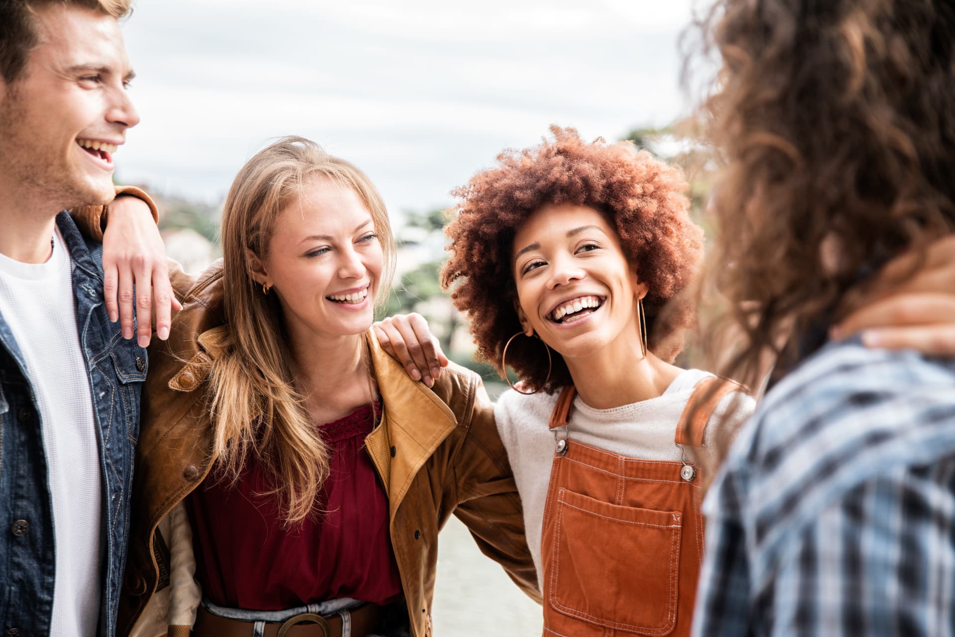 Friends laughing together outdoors